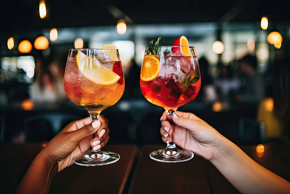 two hands holding non alcoholic beer and drinks two hands holding non alcoholic beer and drinks