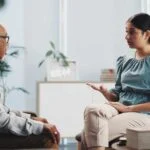 Therapist guiding a client through recovery activities designed to support personal growth and sustained recovery.
