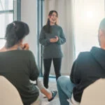 A therapist explaining the difference between PHP and IOP