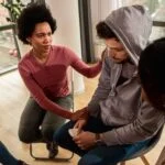 a-man-being-comforted-in-therapy