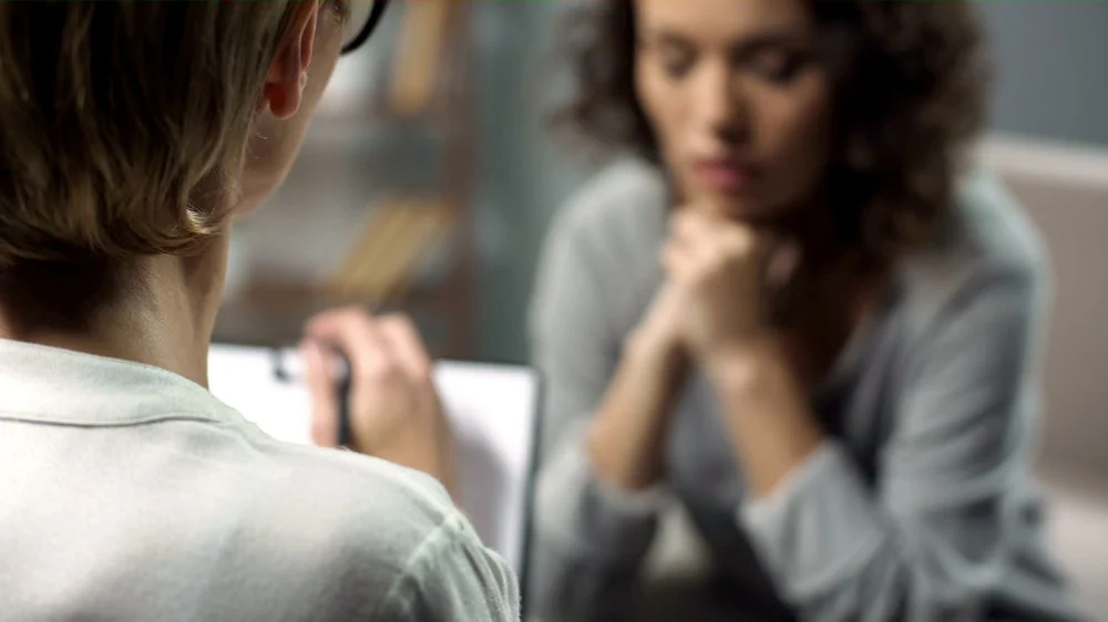 girl in individual IOP treatment session with therapist support