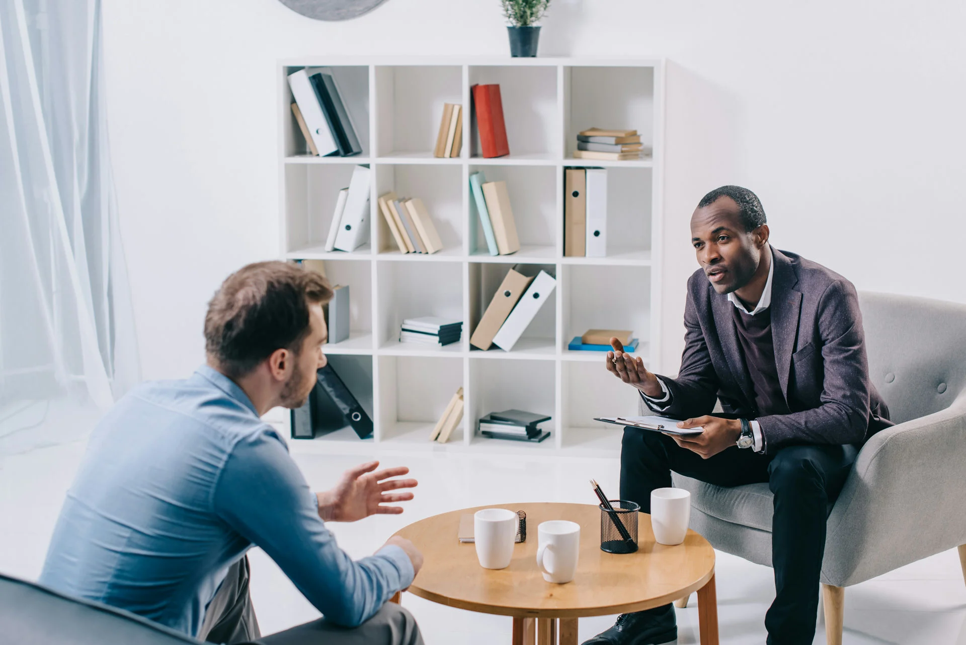 man listening to therapist about ecstasy treatment