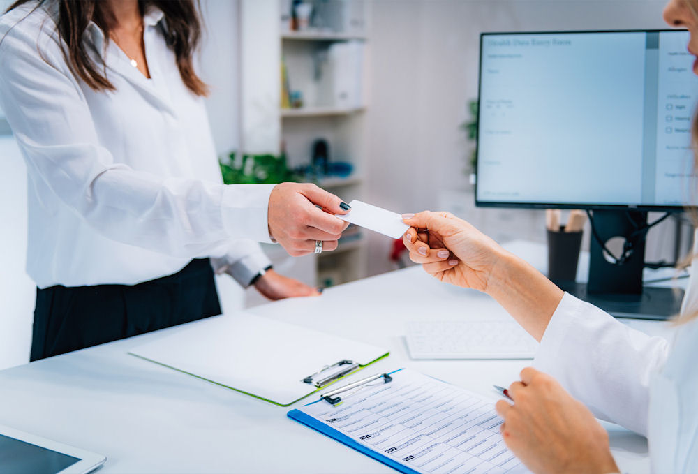 person showing insurance card