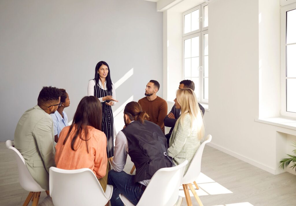 men and women in group therapy