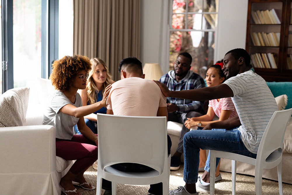 staging an intervention with friends and family offering emotional support