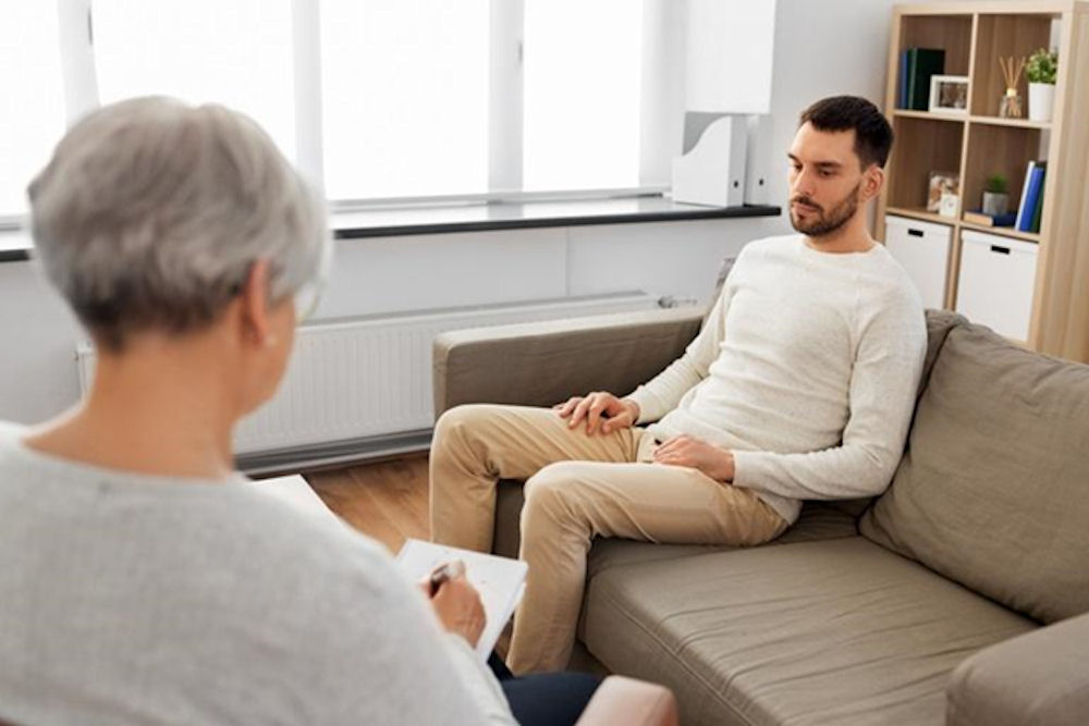 Man receiving individual counseling as part of his stimulant rehab journey