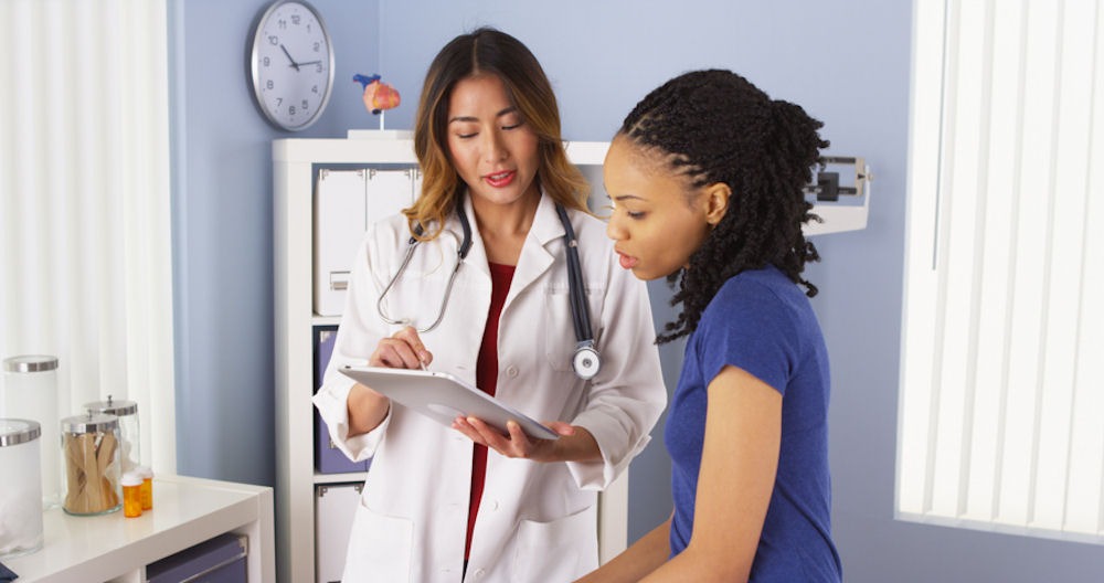 a woman speaking to her doctor