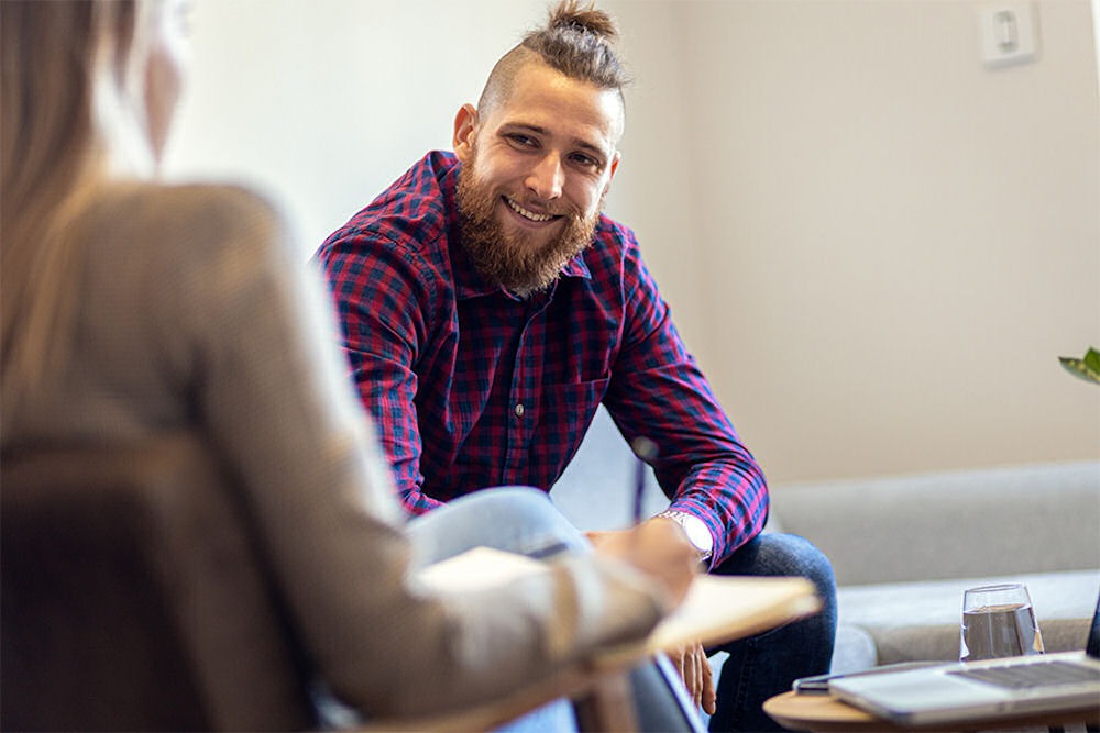 A group therapy session focusing on the benefits of being sober and recovery.