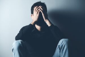 Man overwhelmed by addiction and depression in need of cocaine rehab treatment