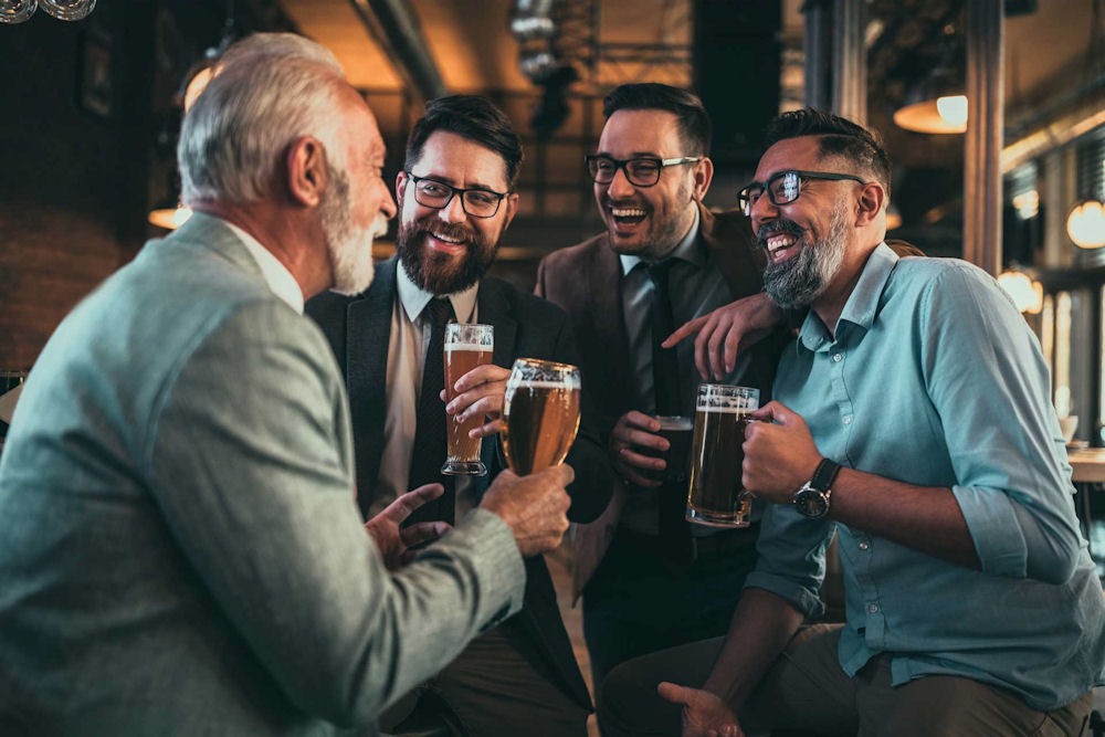 a group of men drinking alcohol