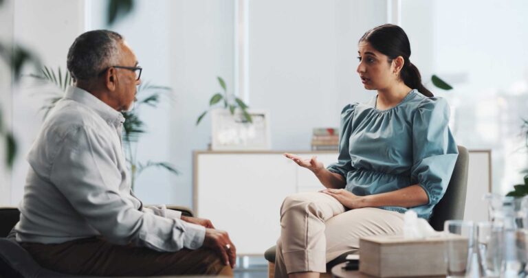 Therapist guiding a client through recovery activities designed to support personal growth and sustained recovery.