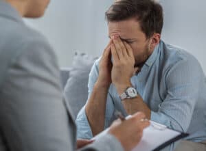 man attending combined addiction and psychiatric treatment services in Washington