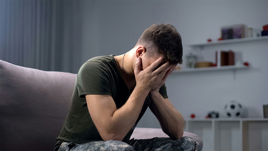 veterans with PTSD and alcohol abuse sitting with heads down