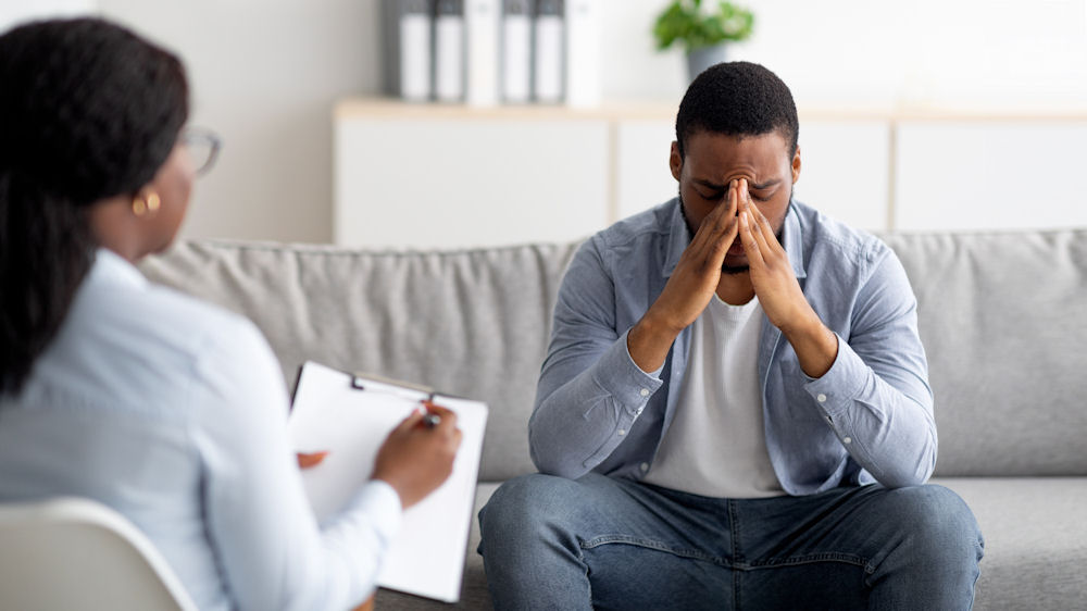 Therapist in Washington guiding a client through trauma counseling